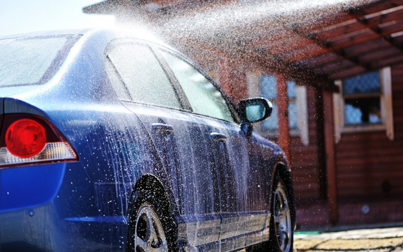 Blue-car-washing-on-open-air-14775710